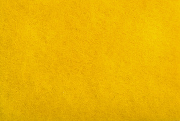 A close up of Yellow felt material background.