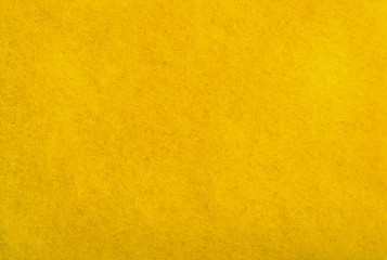 Fototapeta premium A close up of Yellow felt material background.