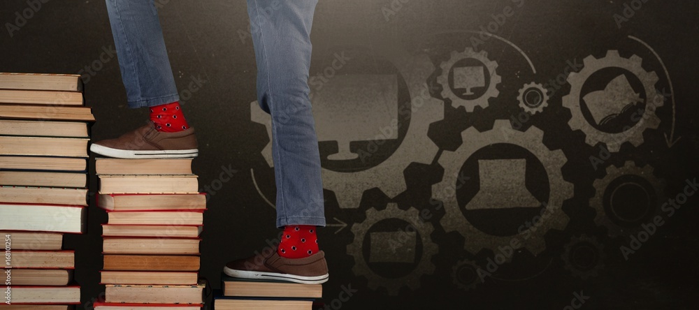Poster composite image of low section of boy climbing stack of books
