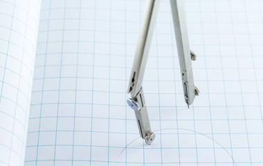 Drafting Compass on paper background