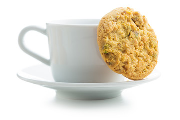 Sweet pistachio cookies and coffee mug.
