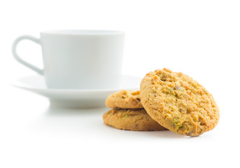Sweet pistachio cookies and coffee mug.