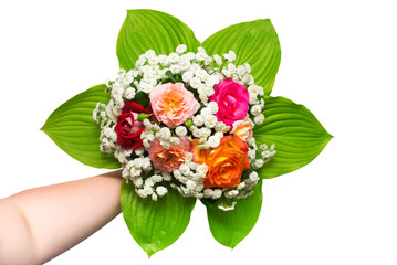 A bride's bouquet of beautiful roses and yarrow with hosta leaf in the girl hand. Flowers. Spring. Flat lay, top view. Love. Valentine's Day. Easter. Wedding card. Object