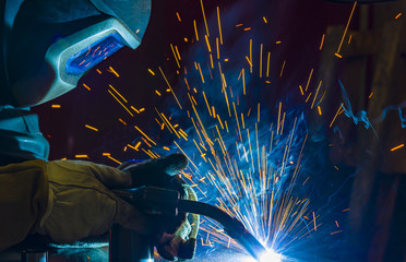 Industrial steel welder in factory