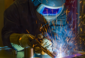 Industrial steel welder in factory