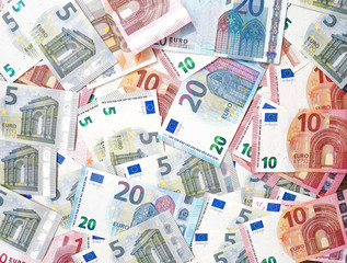 Euro banknotes as a background, a lot of cash, coins, concept, economy growth, currency, crypto currency, new technology