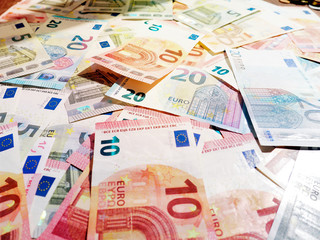Euro banknotes as a background, a lot of cash, coins, concept, economy growth, currency, crypto currency, new technology