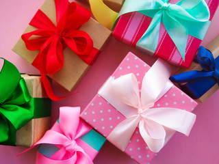 many color gift boxes with colorful ribbons, as a symbol of the holiday, gift.