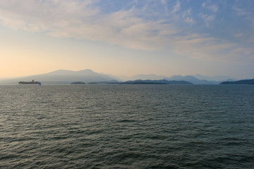 Canadian shore along strait of Georgia with a ferry crossing
