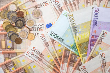 euro banknotes as background. 50 100 200 500