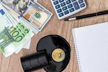 barrels of oil, dollar, euro, bitcoin, diagram, pen and calculator