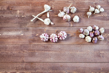 Obraz na płótnie Canvas Garlic. Garlic Cloves and Garlic Bulb on a wooden vintage rustic table. Top View. Copy Space