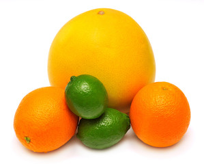 Assorted tropical fruit lime, orange and pomelo isolated on white background. Yellow, orange and green. A healthy and nutritious food for health after training in sports for burning fat
