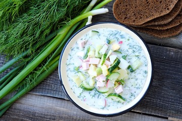 Delicious cold soup okroshka and fresh herbs 