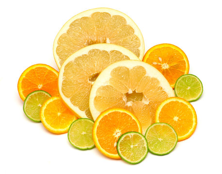 Fruit of citrus orange, lime and pomelo sliced isolated on white background. A healthy and nutritious food for health after training in sports for burning fat. Flat lay, top view