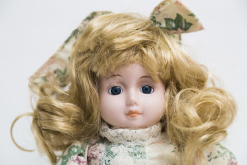 Ceramic porcelain handmade doll with long blond hair and floral dress