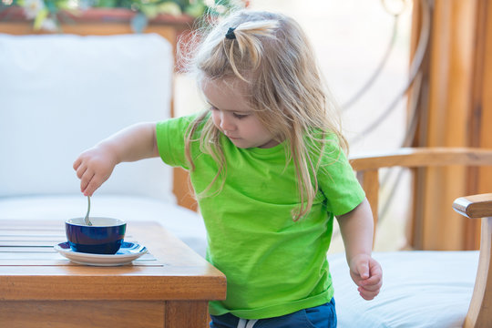 Little Kid Boy Making Tea.