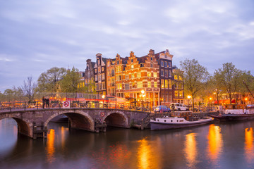 Fototapeta na wymiar One of the famous canal of Amsterdam, the Netherlands at dusk