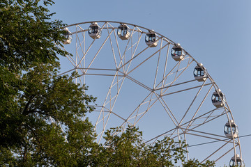Multicolour ferris wheel on blue sky background