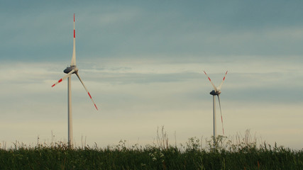 Wind turbines in the field, overcast. Clean and Renewable Energy, Wind Power, Turbine, Windmill, Energy Production