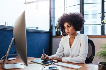 Female designer working in office