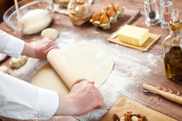 Fototapeta na wymiar Bread Making Dough With Pin Knead Pastry Bakery Kitchen Man Cooking Process Concept