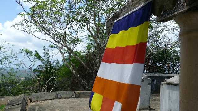 Buddhism flag at Mulkirigala Raja Maha Vihara an ancient and an archaeological Buddhist temple in Mulkirigala Sri Lanka