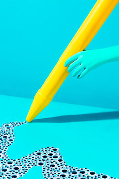 giant yellow crayon with googley eyes doodle, on blue background, conceptual