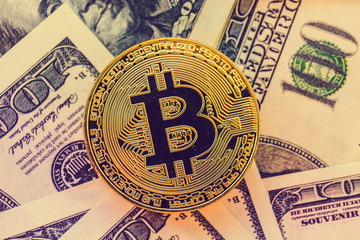 Gold Bitcoin on US dollars background