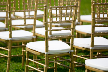 gold and whiteChairs for wedding ceremony