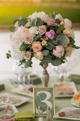 Table with flowers set for an event party or w edding reception,