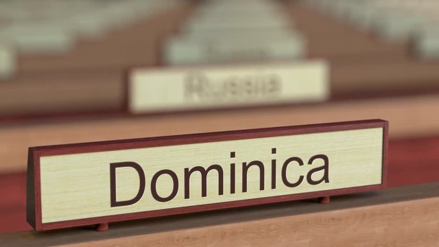 Dominica name sign among different countries plaques at international organization. 3D rendering