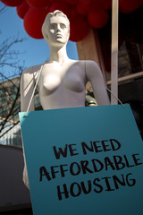 Expensive housing price model female protesting abstract