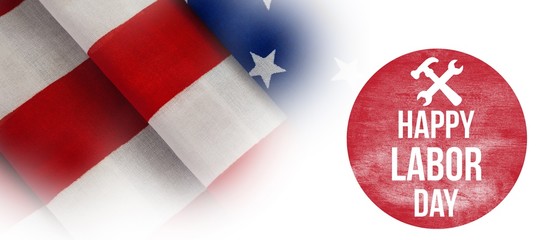 Composite image of happy labor day text with tools on red poster