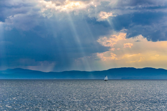 Boat on Lake Champlain under storm clouds