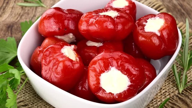 Rotating Red Peppers with Cheese (seamless loopable 4K UHD footage)