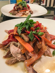 Roasted duck with red pepper, carrot and green onion
