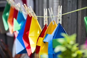 Hanging paper boats on the line