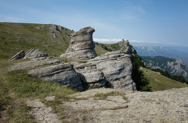 Rock weathering on the background of mountain landscape