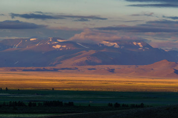 Scenic sunset and sunrise in mountainous region of Altai