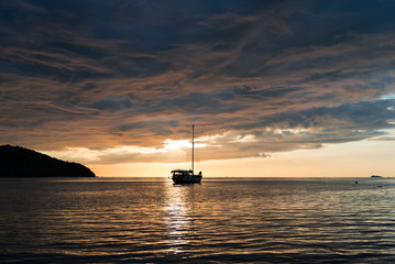 twilight scene of boat with cloudy sky