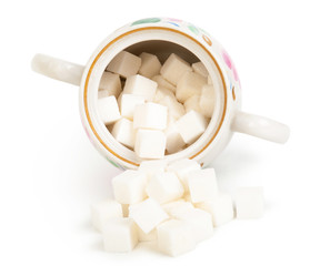 Sugar cubes in a bowl isolated on white background