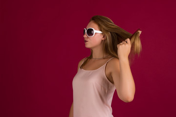 Young cute girl with comb, studio  