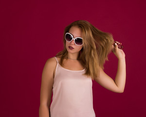 Young cute girl with comb, studio  