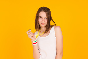 Young cute girl with medal, studio  