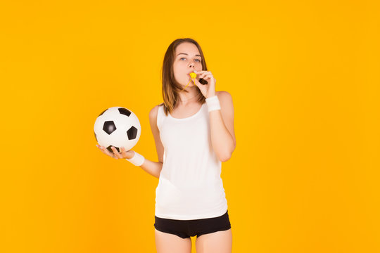 Young Cute Girl Holds A Soccer Ball, Studio  