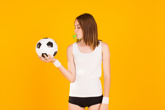 Young Cute Girl Holds A Soccer Ball, Studio  