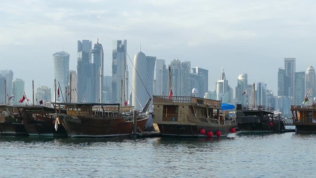 Traditional Dhow, Arab sailing vessels in the Dhow Harbour with the Doha skyline in the background