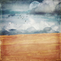 Vintage grunge textured deserted sand dune landscape with half moon and flock of birds. Digital...