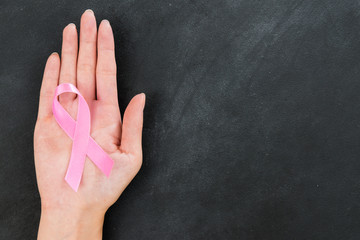 pink ribbon showing breast cancer care concept